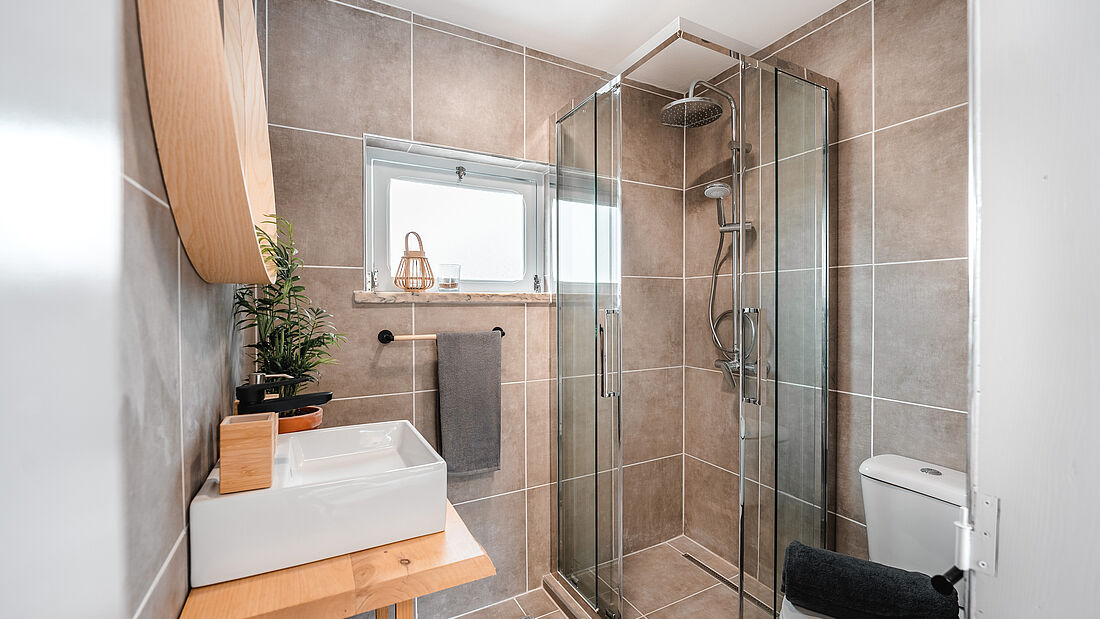 Cozy bathroom with rain shower pure surf camp peniche portugal apartment