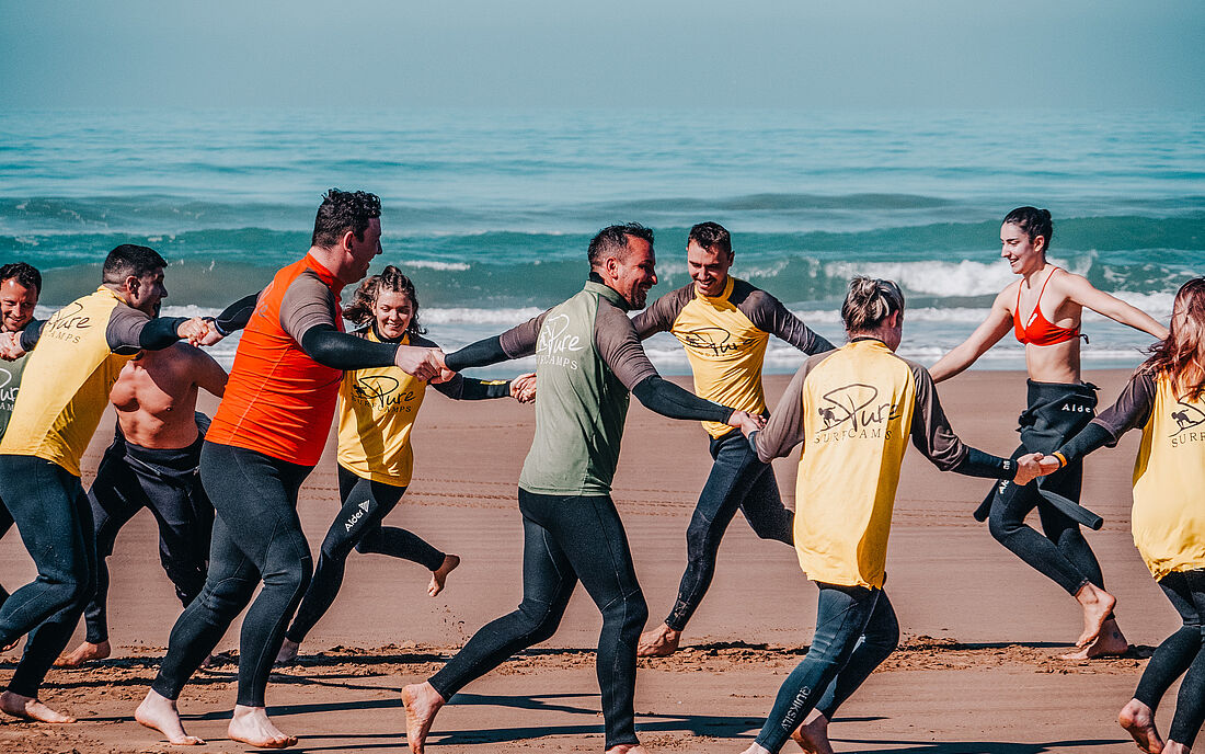Warming up as a team before the surf session.