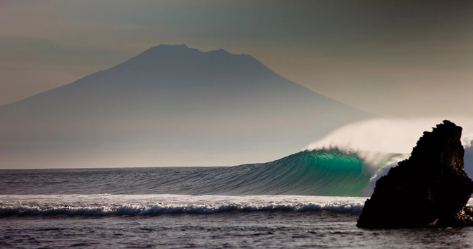Surf House Bali Canggu scenery wave sunset volcano