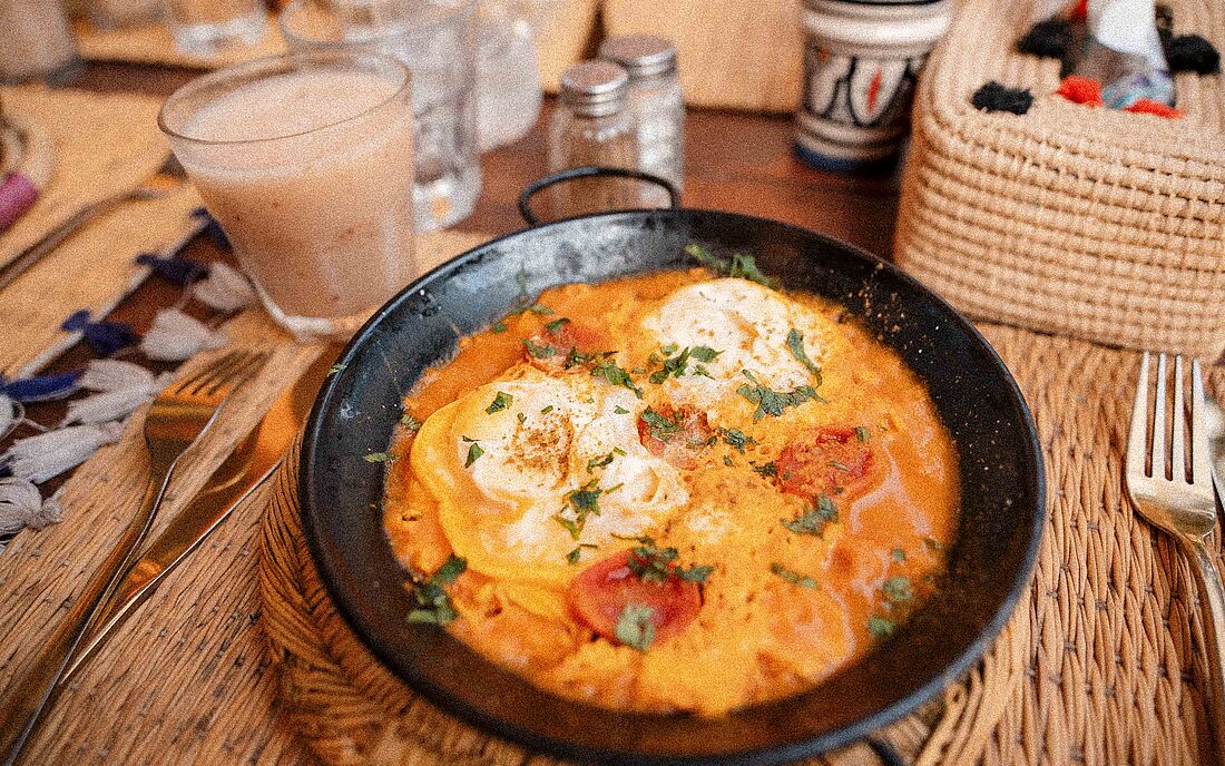 Enjoying a traditional tagine in the market