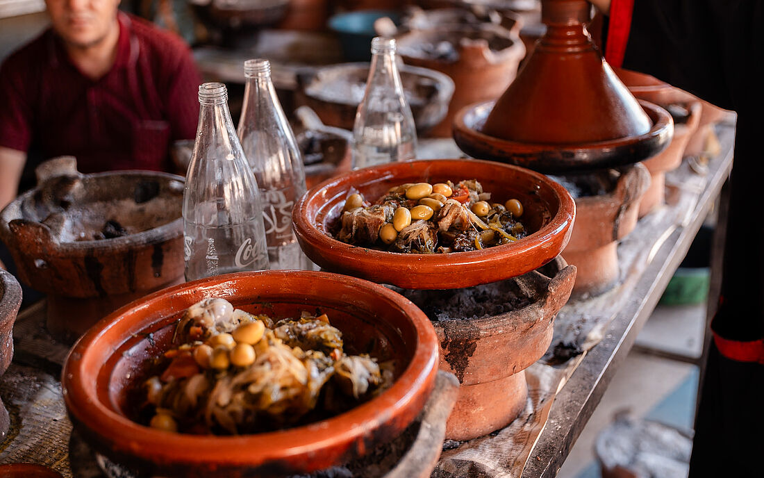 Tajine is a slow-cooked stew featuring diverse ingredients.