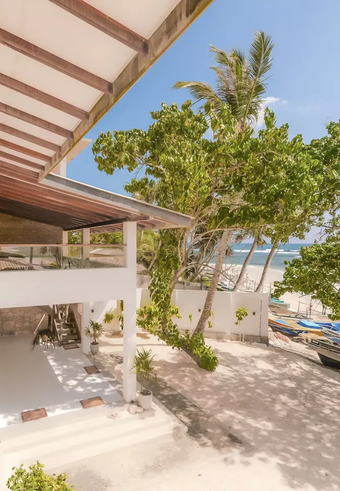 View from the terrace of the garden, beach and sea
