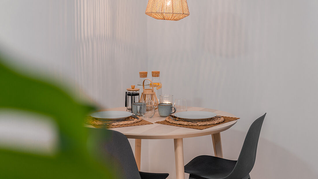 The cozy dining room table pure surf camp peniche apartment accommodation